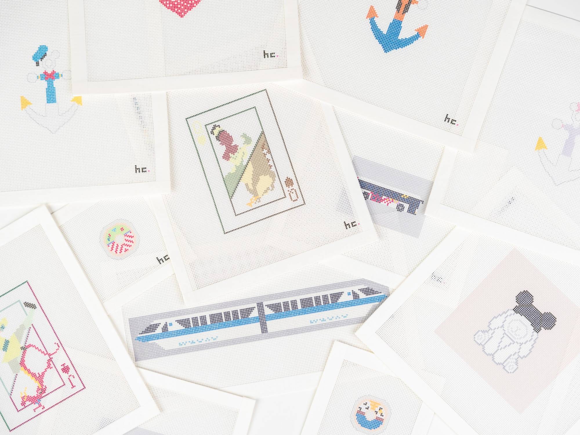 A collection of HC printed canvases featuring parks, playing cards, and travel designs