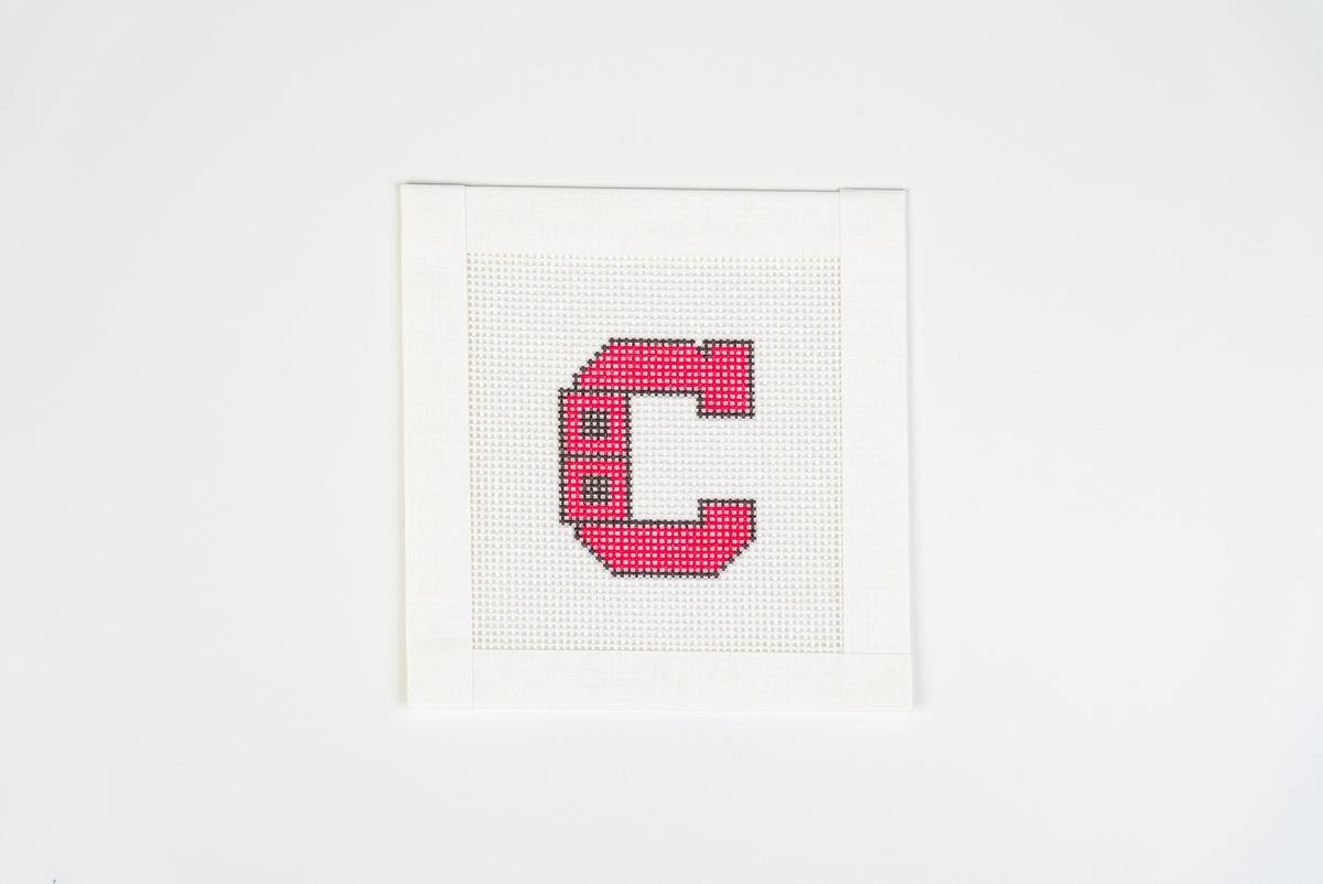 Retro Hockey C printed needlepoint canvas, blocky red letter C with black outline and two black squares on the left, on 18 mesh, full view