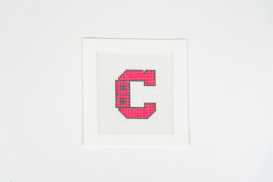 Retro Hockey C printed needlepoint canvas, blocky red letter C with black outline and two black squares on the left, on 18 mesh, full view