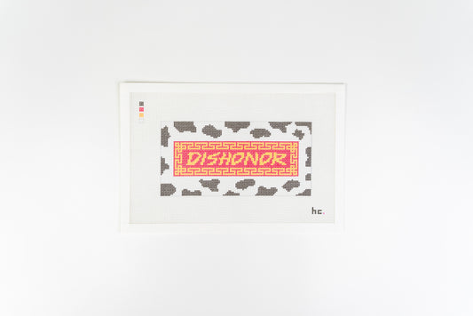 Dishonor on Your Cow printed needlepoint canvas: gold DISHONOR lettering on a red banner with a gold fretwork border, over black and white cow print, on 13 mesh canvas