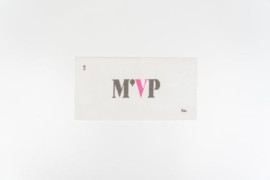 Printed needlepoint canvas reading M'VP in charcoal serif capitals with a hot pink V on open white canvas, 13 mesh, full view