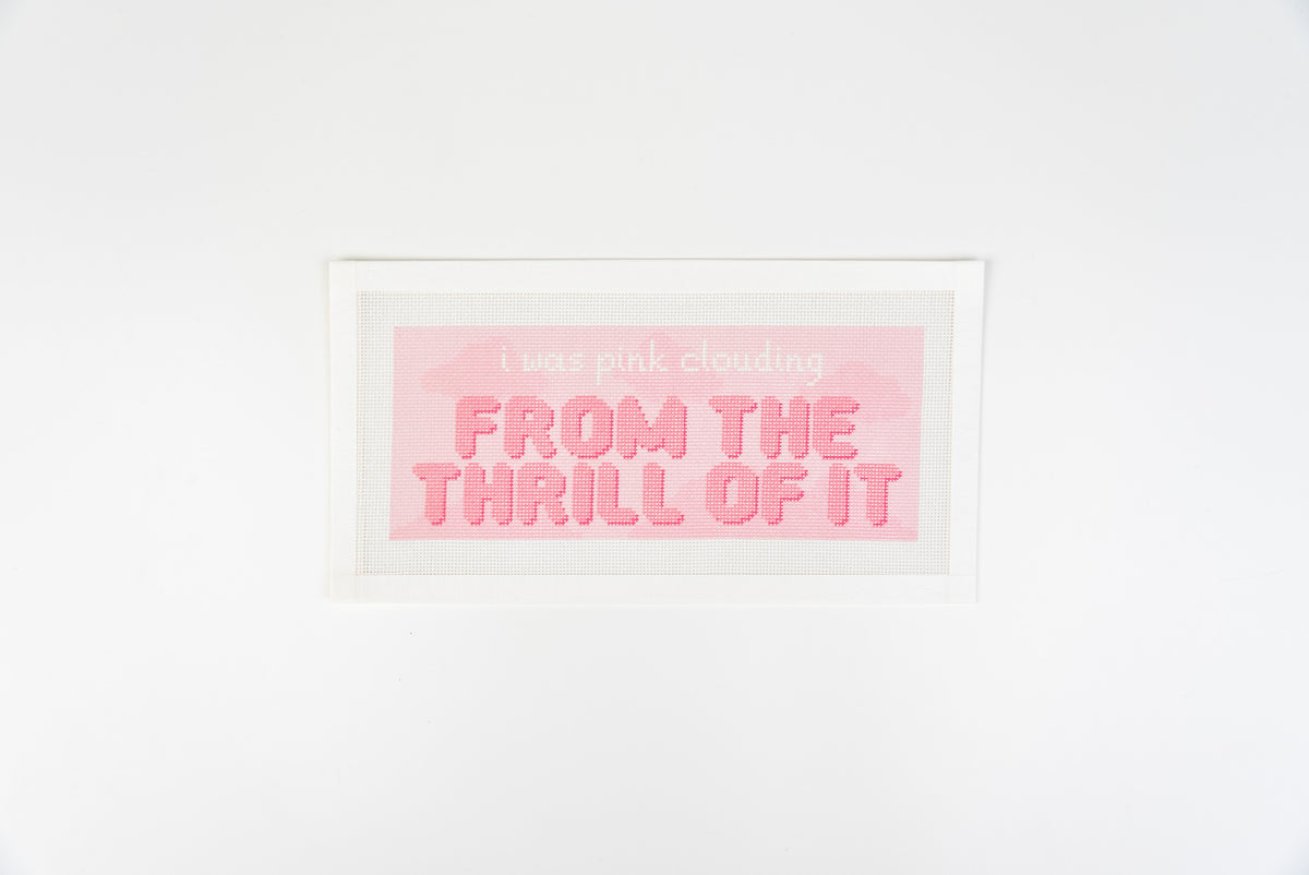 Pink Clouding needlepoint canvas, white script and puffy coral pink letters on a pale pink cloud background, 18 mesh, full view