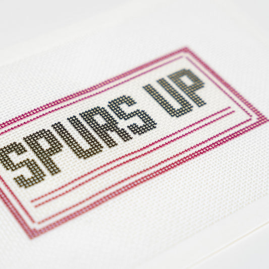 Spurs Up, stitched detail close up